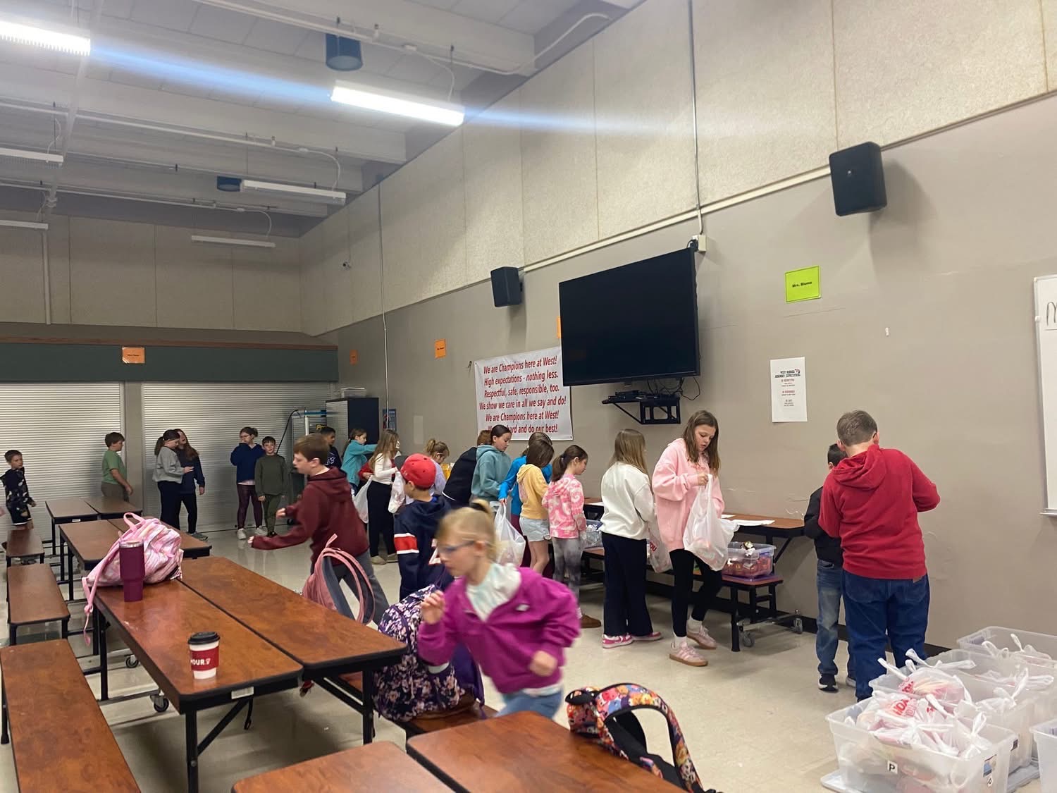 Children picking up their weekend care packs at school